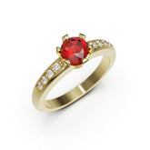 Gold ring with a red gemstone and smaller diamonds on a white background